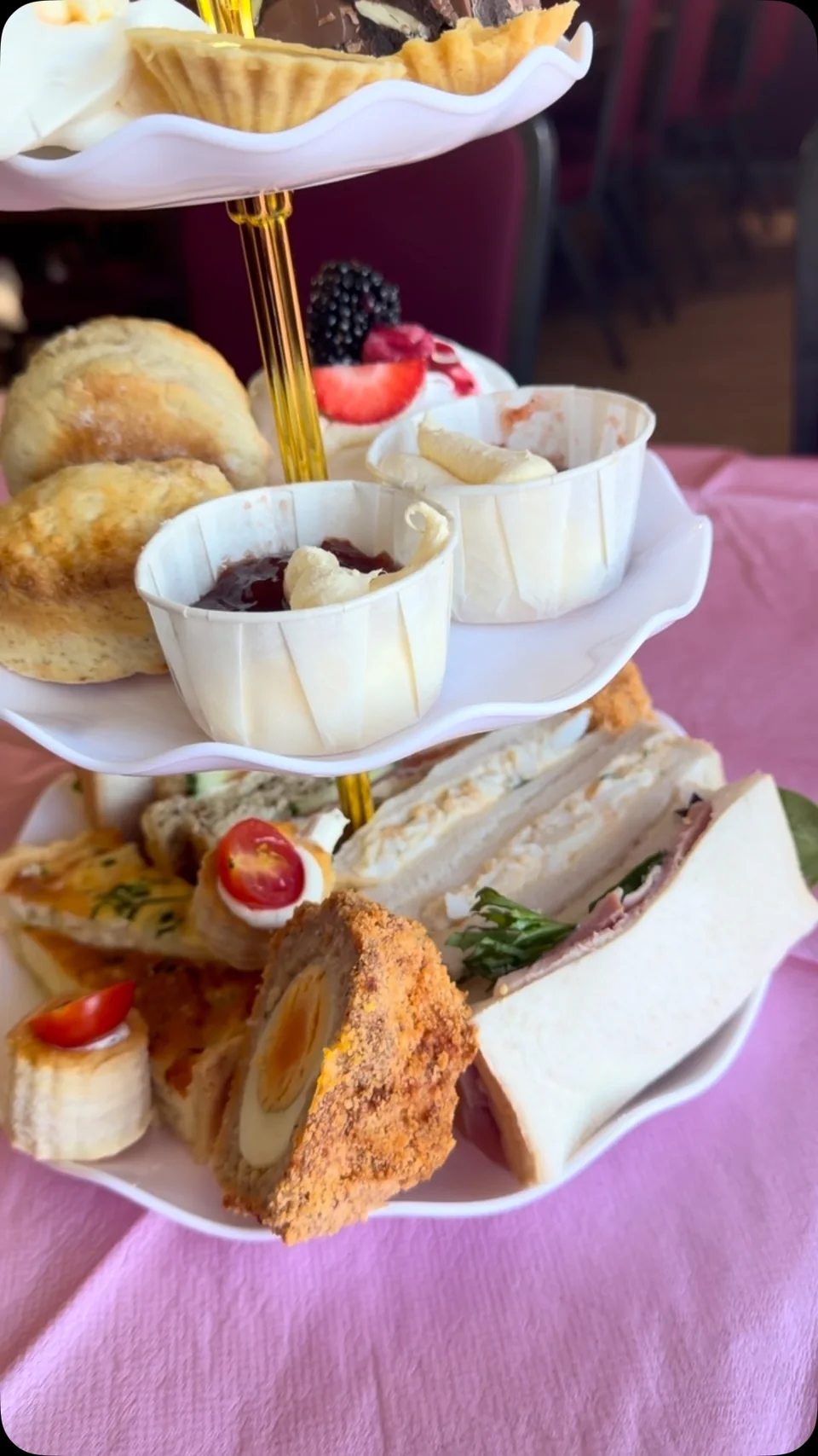 Afternoon tea with homemade sandwiches, scones and cakes